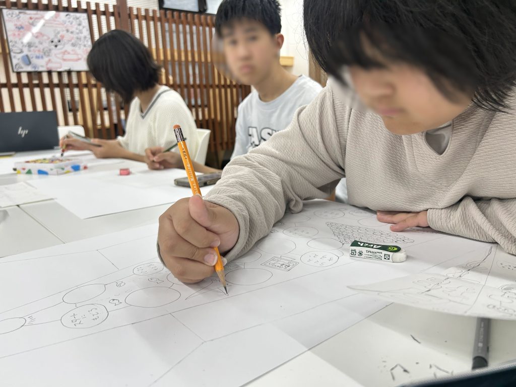 埼玉県所沢市にあるフリースクール、クラーク国際中等部所沢キャンパスで行った、環境ポスター制作の様子